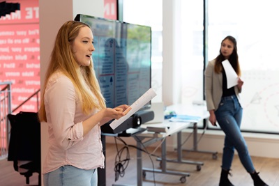 Two entrepreneurs pitching at Bright Red Triangle