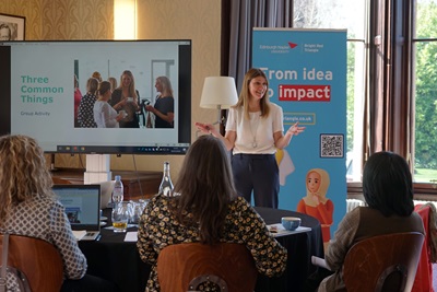 A woman leading a group discussion at Edinburgh Napier University's Craiglockhart campus