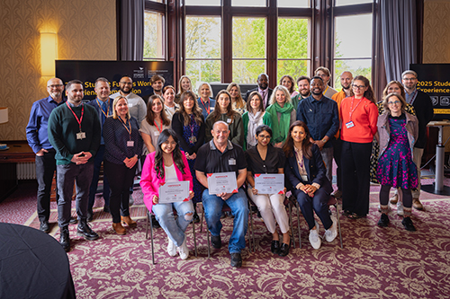 Attendees at the 2025 competition event pose for a photograph