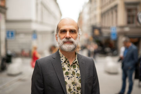 portrait of Bruce Schneier on a city street 