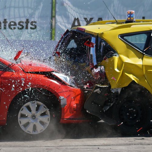 Close up image of one test car crashing into the back of another