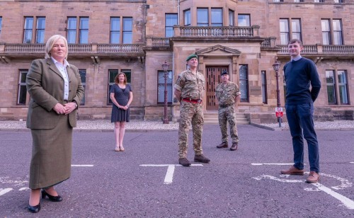 Socially distanced line-up of three civilians and two uniformed soldiers outside the old Craiglockhart military hospital