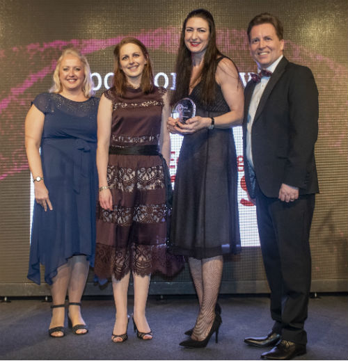 Kerry Dewar and Fiona Forrest-Anderson on stage receiving the Diversity in Business Award