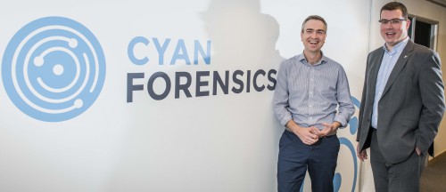 Ian Stevenson, CEO Cyan Forensics (right) with Paul Devlin, Investment Manager, Mercia Fund Managers, in front of company logo.