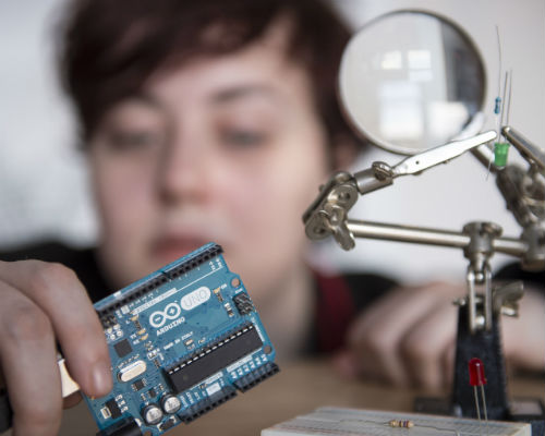 close up of student with circuit board 