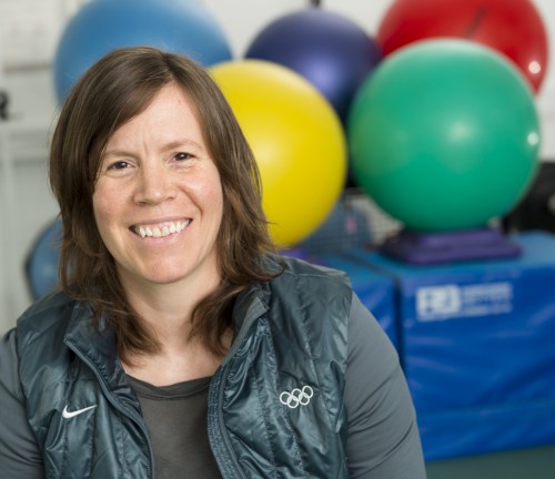 Dr Debbie Palmer-Green posing in front of exercise balls