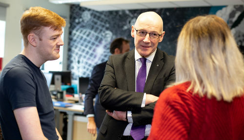 Cabinet Secretary John Swinney with teaching students