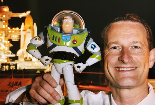 Duncan Wardle holding up Buzz Lightyear