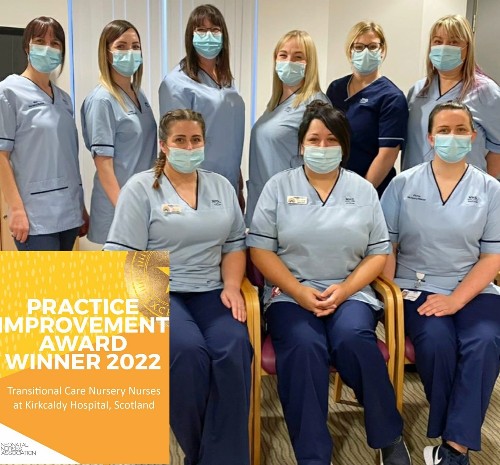 Two rows of uniformed nurses with caption bottom left announcing their award win