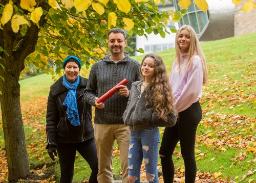 James Homan, 2020 Auturm graduate, with family in the grounds of Craiglockhart