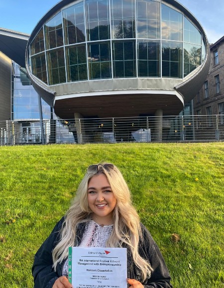 Jenna Neeson on the lawn at Craiglockhart campus in front of The Egg lecture theatre