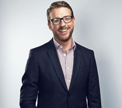 Portrait of JJ Chalmers in suit jacket and open-neck shirt