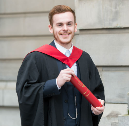 Jordan Szafranek with degree scroll outside the Usher Hall