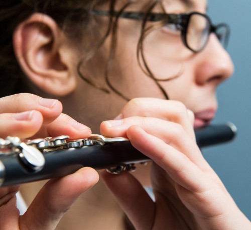 A woman playing the flute