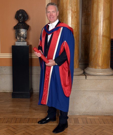 Mark Naysmith with degree scroll inside the Usher Hall