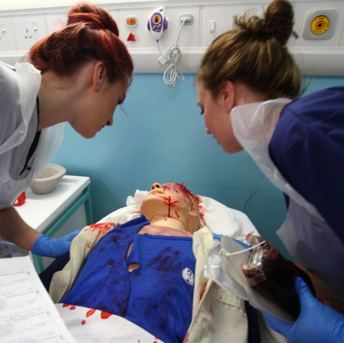 Two nurses working in a clinical skills lab at Edinburgh Napier University