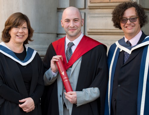 Simon Hunter with two other people at graduation