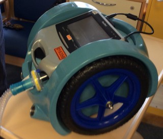 A piece of blue, circular machinery
