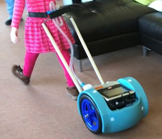 A ventillator on wheels being pulled by a child