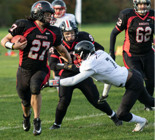 Napier Knights American Football team action shot featuring ball carrier being tackled