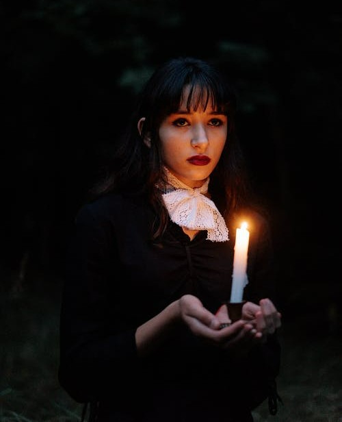 Portrait of a woman dressed in dark clothing