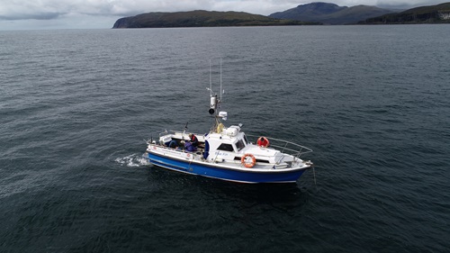 An aerial view of a boat taking part in flapper skate fieldwork off the west coast of Scotland.
