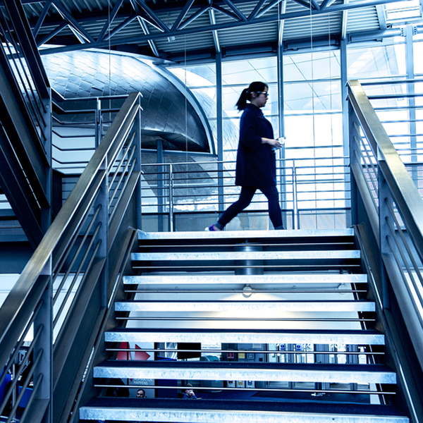 a figure on the blue lit staircase at Craiglockhart campus
