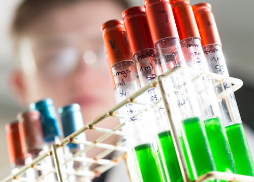 Close up of vials containing coloured liquids in the microbiology lab at Sighthill campus