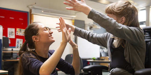 Jodie on a community placement with young child.