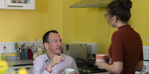Image of Jodie Tocher in the shelter with Andrew