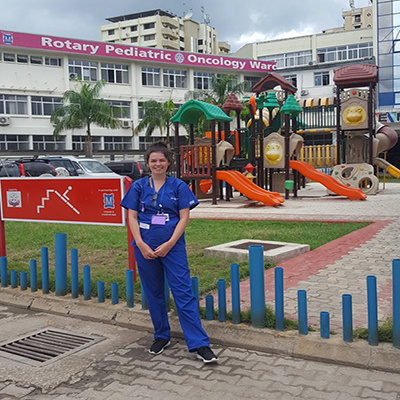 Chloe in front of the hospital in Tanzania