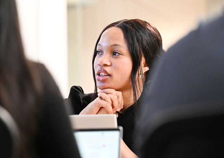 A person listening during a meeting.