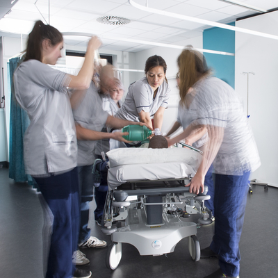 Nursing students practising on a dummy .