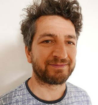 Head and shoulders image of bearded Taulant