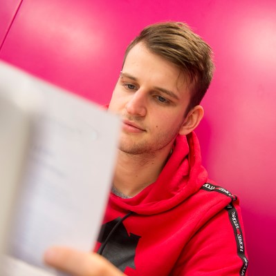 Male student studying on Merchiston campus