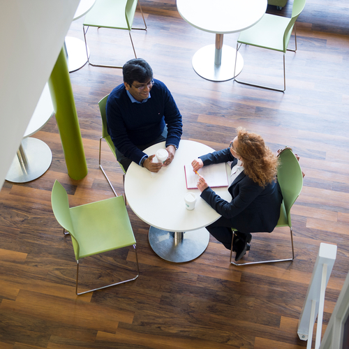 Two people having a meeting at Edinburgh Napier's Merchiston campus.