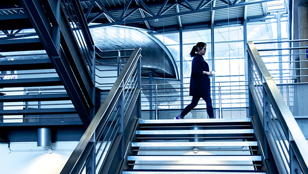 futuristic blue lit staircase on campus