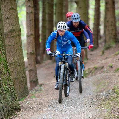 mountain bikers on a hill 