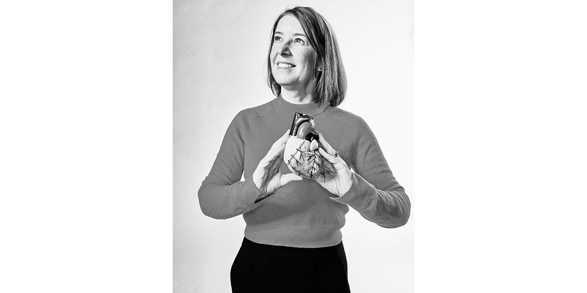 lis, a cardiovascular health researcher and professor at edinburgh napier university, stands with a 3d model of a heart