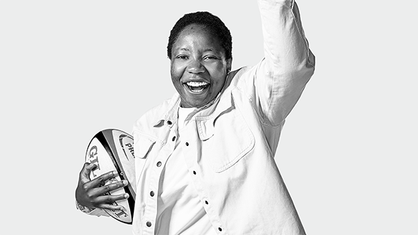 Panashe muzambe holding a football and cheering