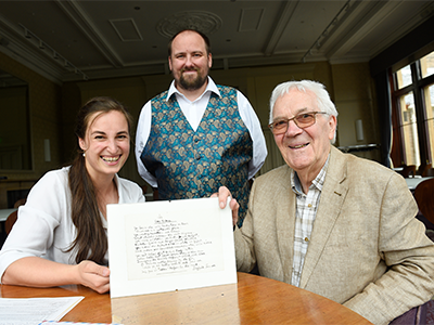 People posing with Siegfried Sassoon poem
