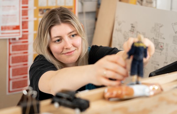 An image of an Edinburgh Napier student working on a creative project in one of our design studios at Merchiston campus. 