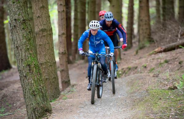 mountain bikers on a hill 