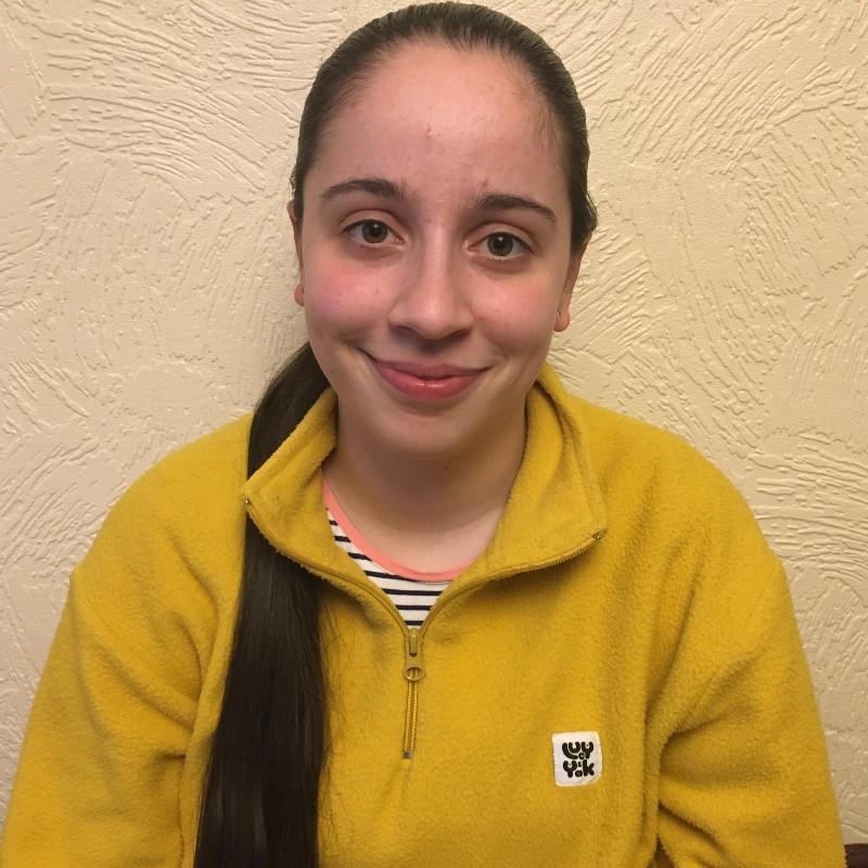 Business student, Stephanie, smiling at the camera. 