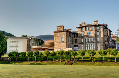 The old and new buildings of Craiglockhart campus on a sunny day.