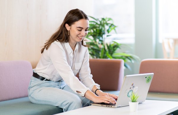 student sitting at their laptop in a peaceful environment 