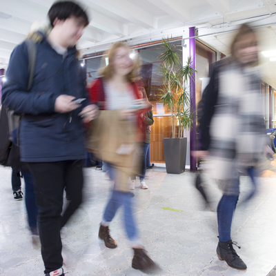 Blurred Students moving between classes in the foyer area at Merchiston.
