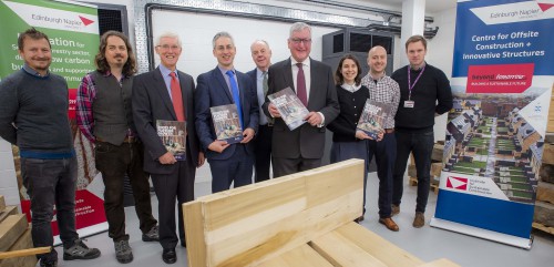 Line-up of timber, wood science and forestry academics with Rural Economy Secretary Fergus Ewing and copies of new strategy document
