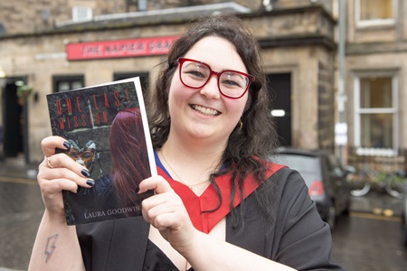 MA Screenwriting graduate Laura Goodwin with her novel One Last Mission